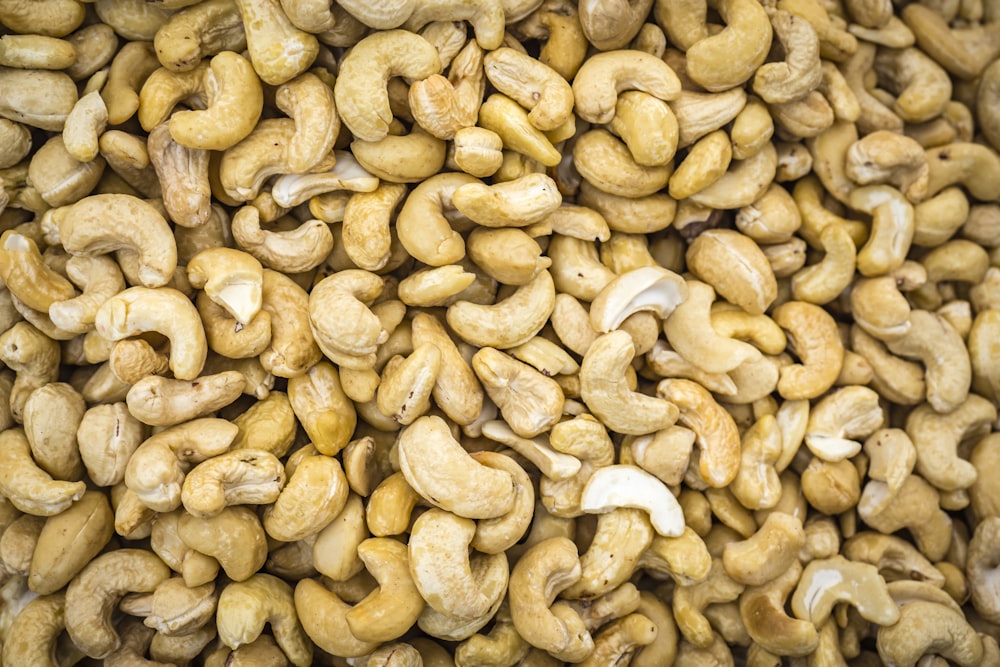 a pile of cashews sitting next to each other