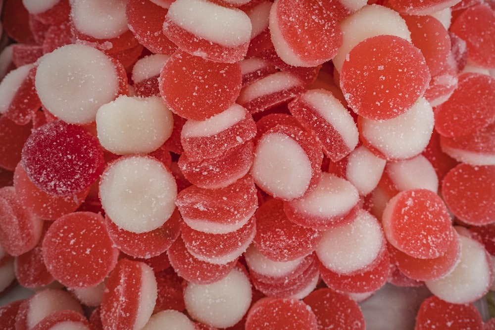 a pile of red and white candies sitting on top of each other