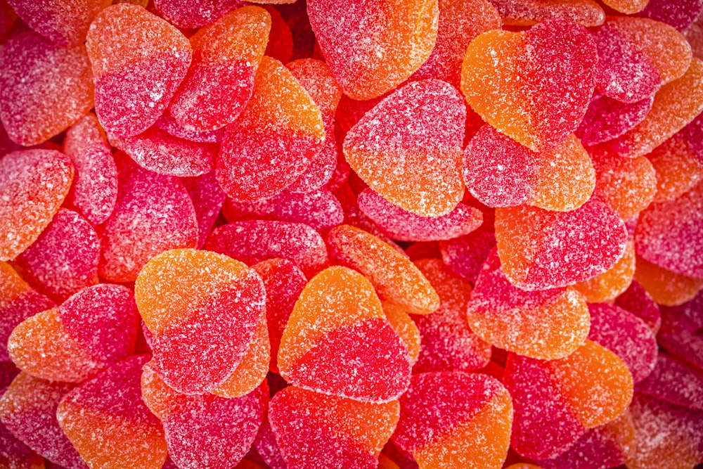 a close up of a pile of candy hearts