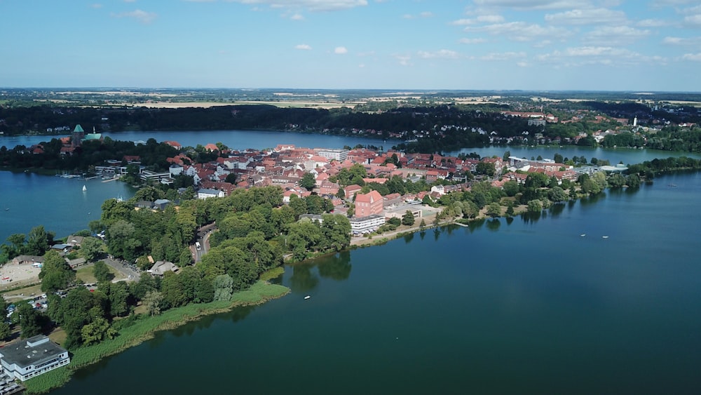 an aerial view of a small town on a lake