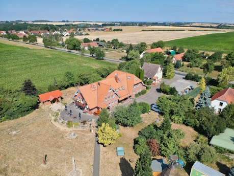 a bird's eye view of a house in the middle of a field