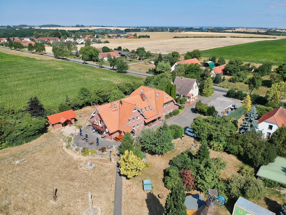 a bird's eye view of a house in the middle of a field