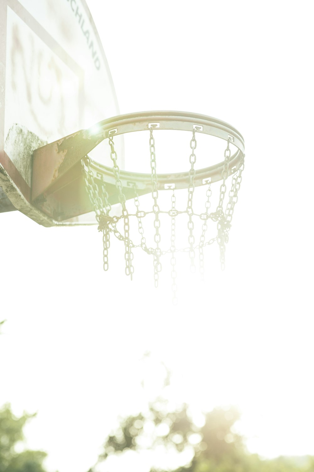 a close up of a basketball going through the hoop