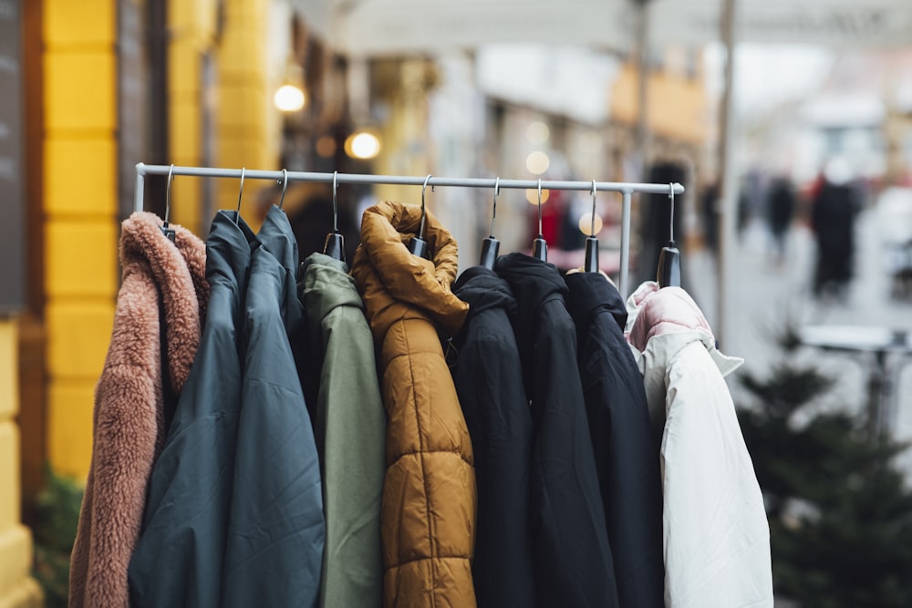 a rack of clothes hanging on a rail