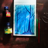Close-up of a detailed ink drawing of a serene forest scene.