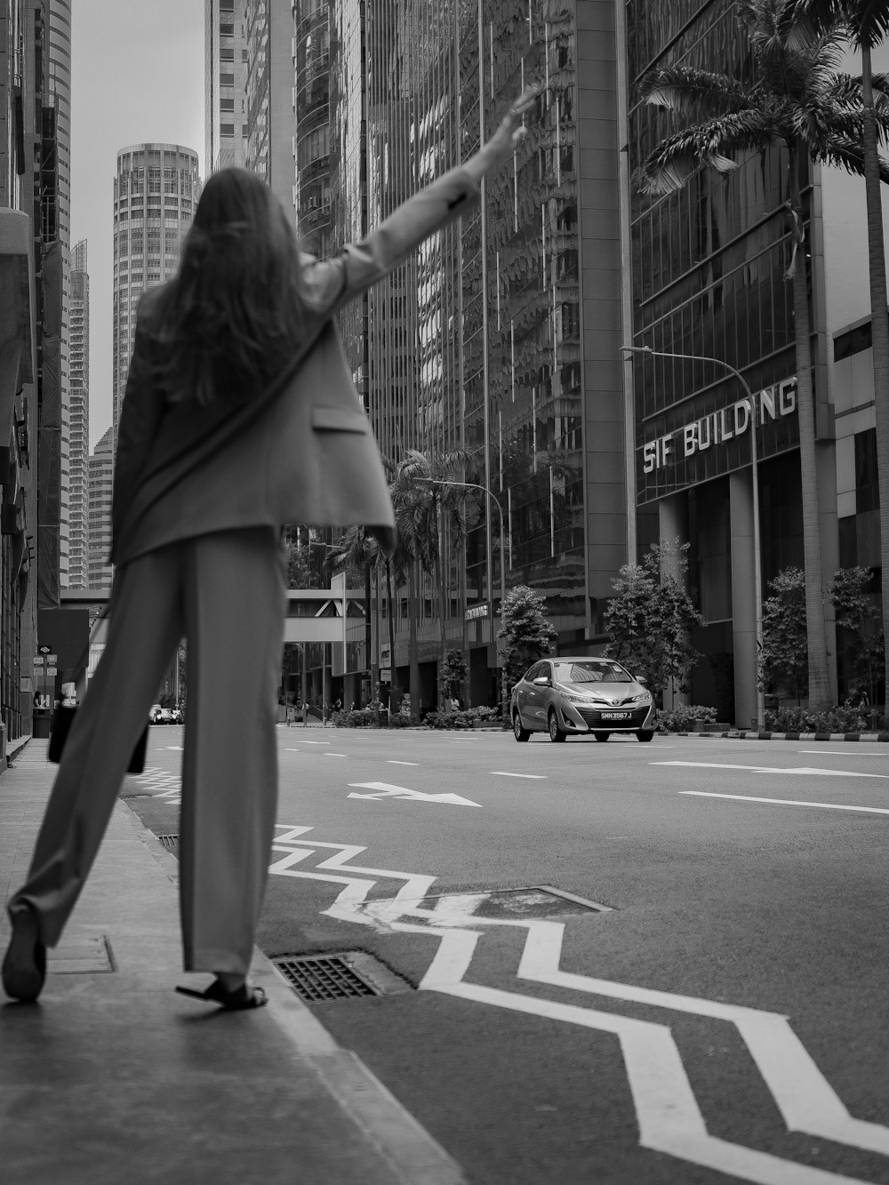 a woman walking down a city street