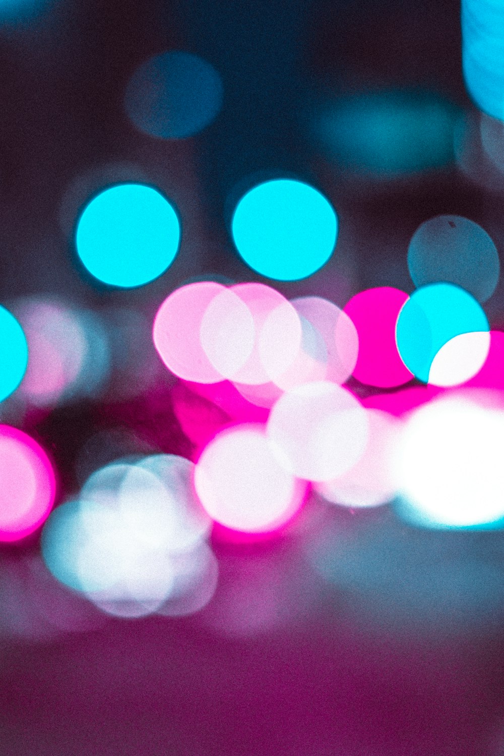 a blurry photo of a city street at night