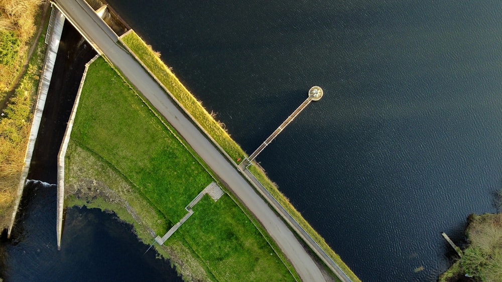 an aerial view of a bridge over a body of water