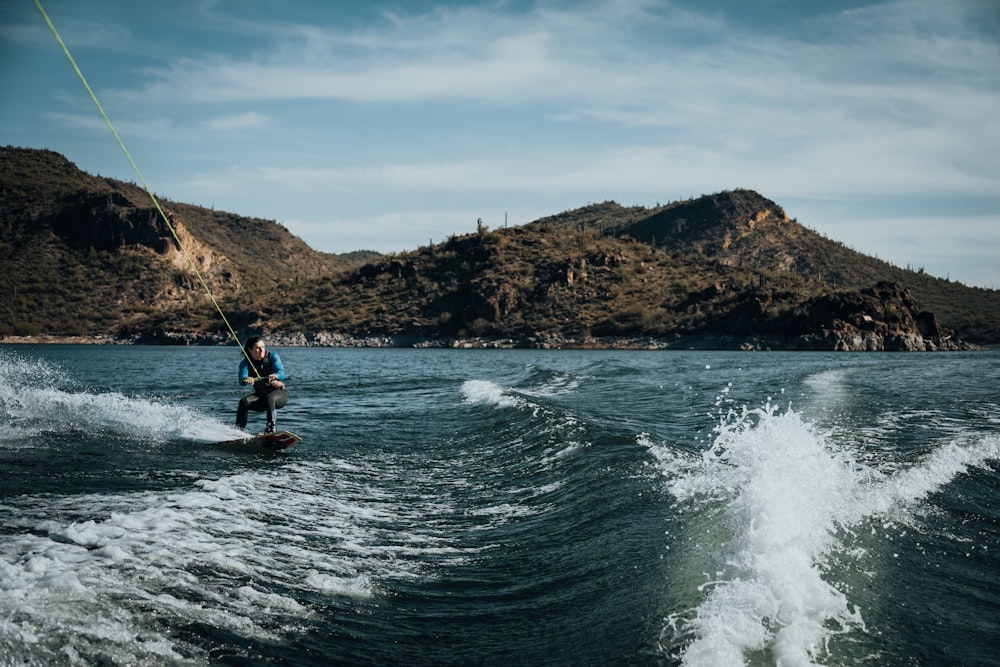 a person on a water ski being pulled by a boat