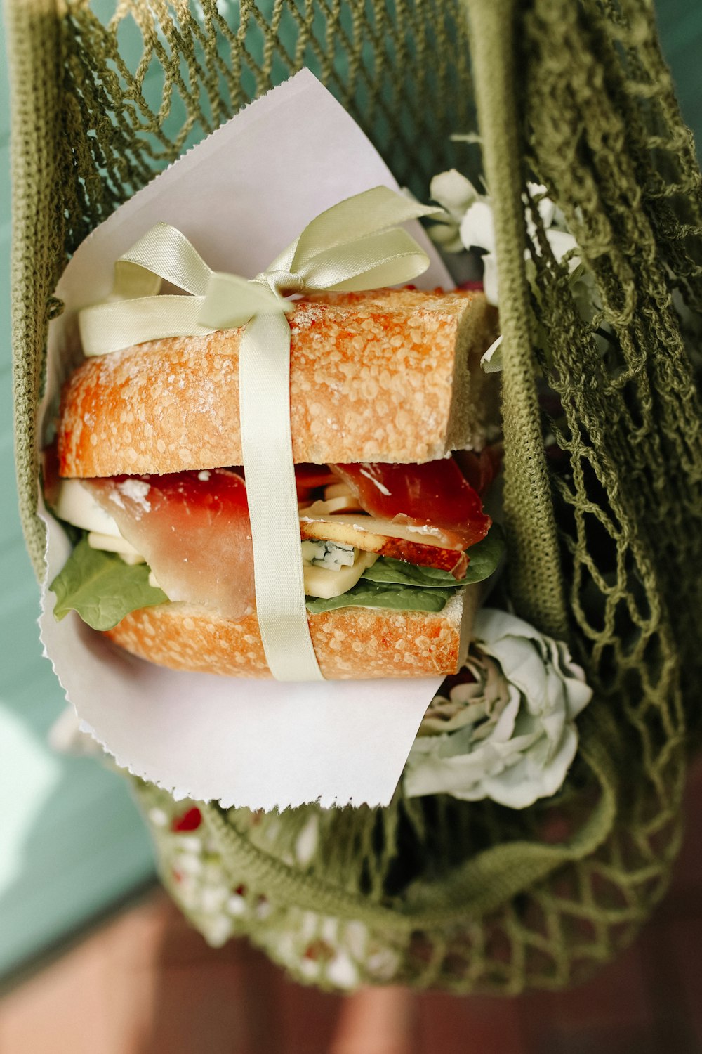 a close up of a sandwich sitting on top of a paper plate