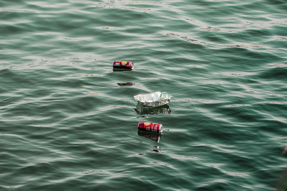 a couple of small boats floating on top of a body of water