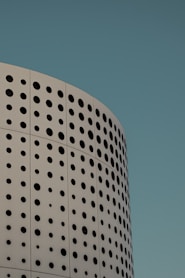 a building with a lot of holes on the side of it