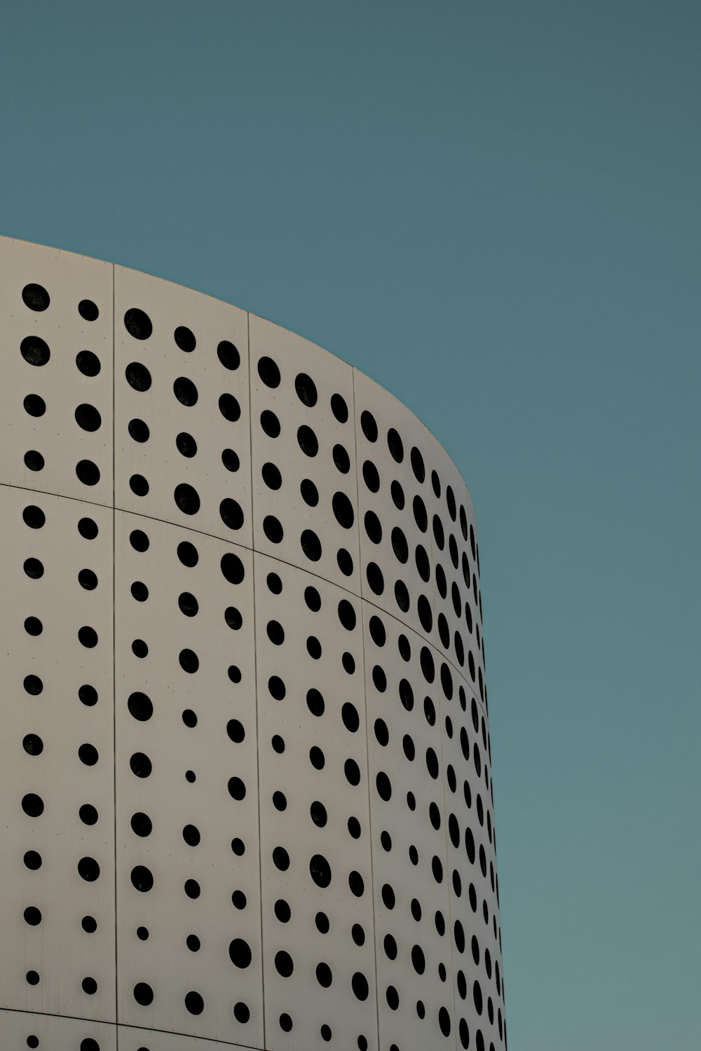 a building with a lot of holes on the side of it