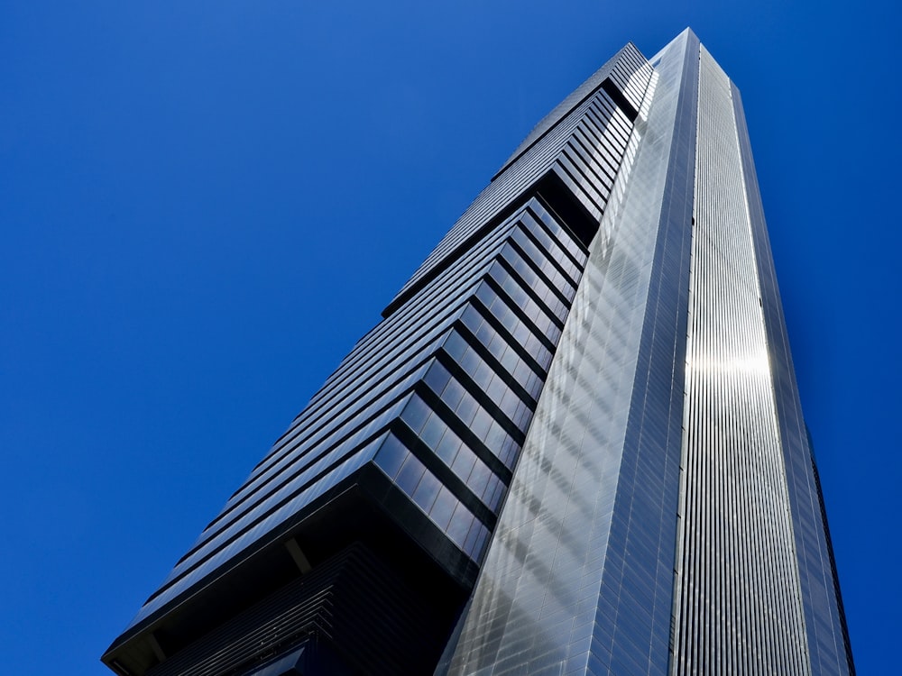 a tall building with a sky background