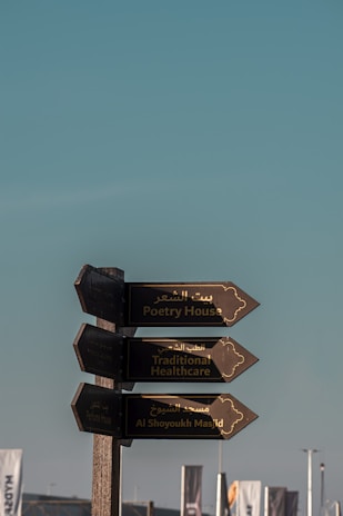 a pole with a bunch of signs on it