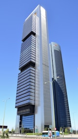 a very tall building sitting in the middle of a street