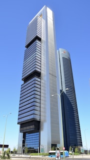 a very tall building sitting in the middle of a street