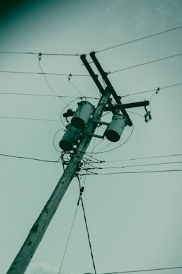 a telephone pole with a couple of lights on it