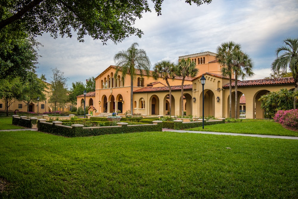 a large building with a garden in front of it