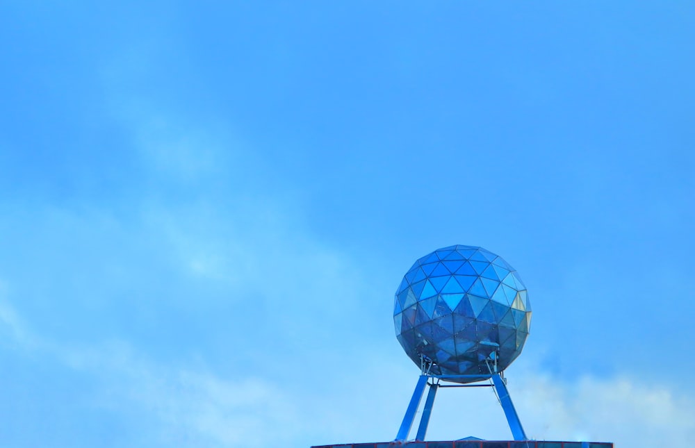 a large blue object on top of a building