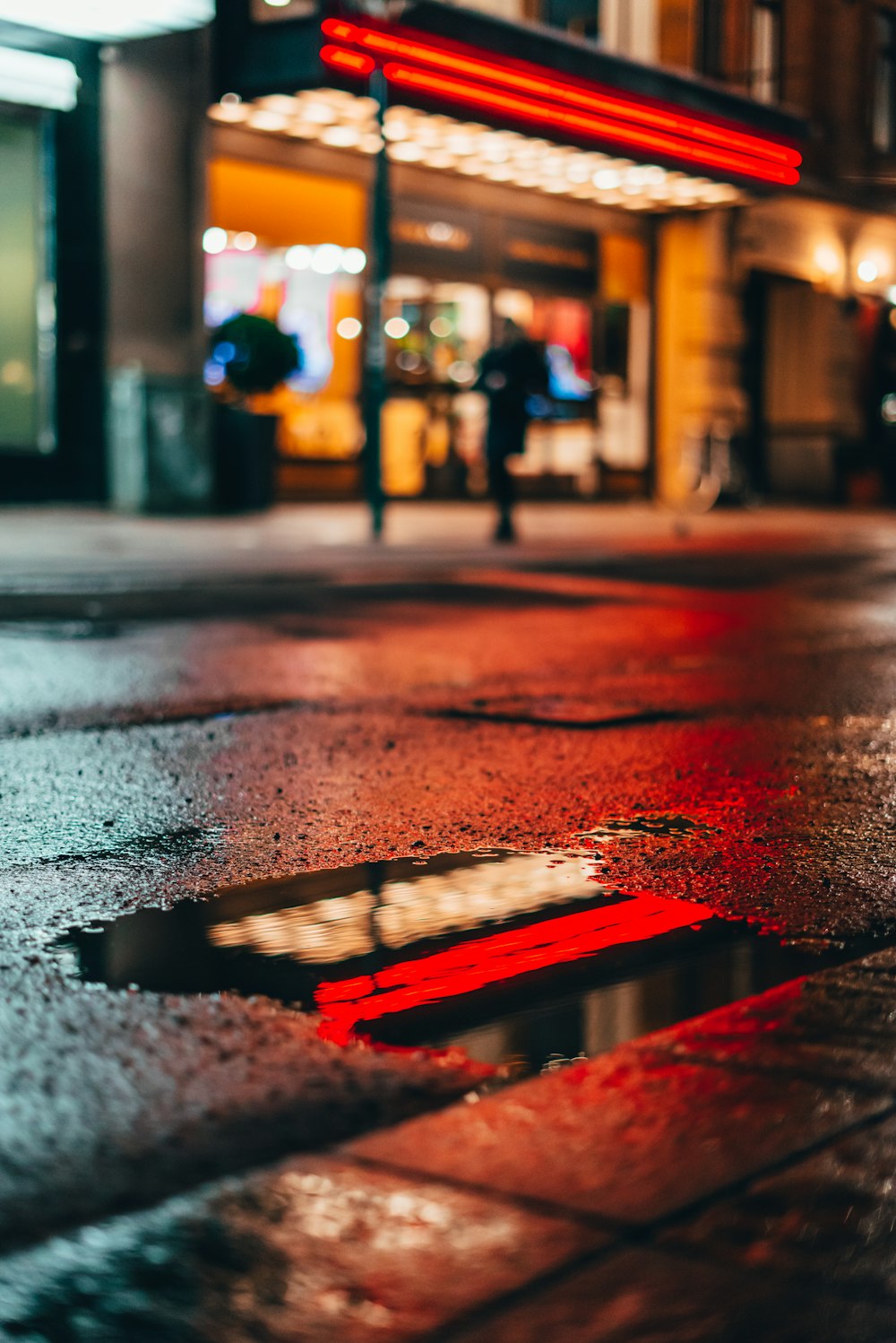 a puddle of water on a city street