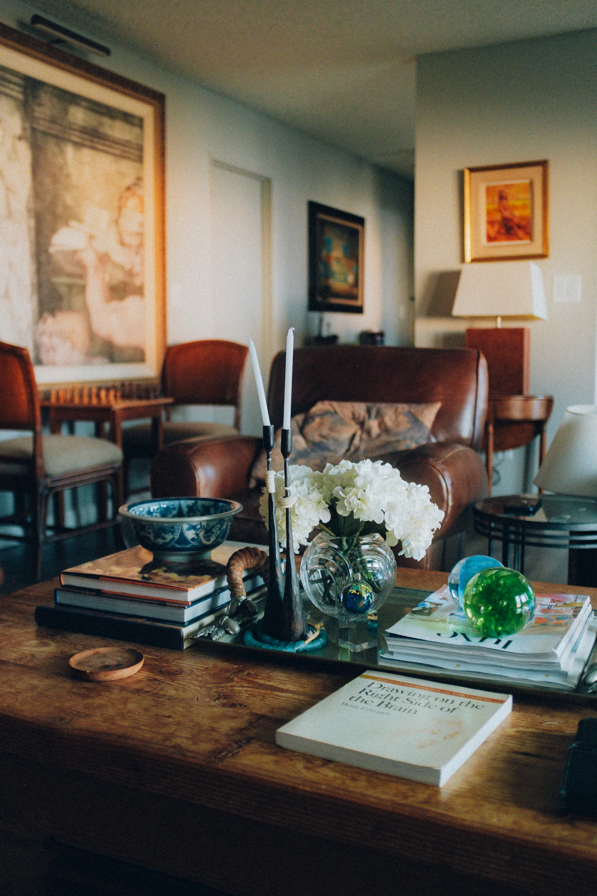 Wooden coffee table and thoughtfully arranged furniture in a warm residential living room