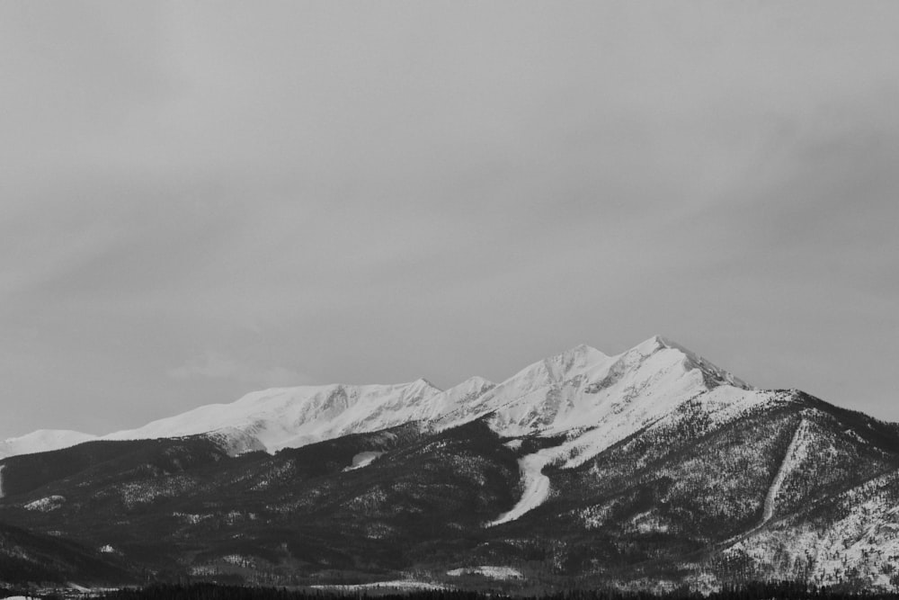 a black and white photo of a mountain range