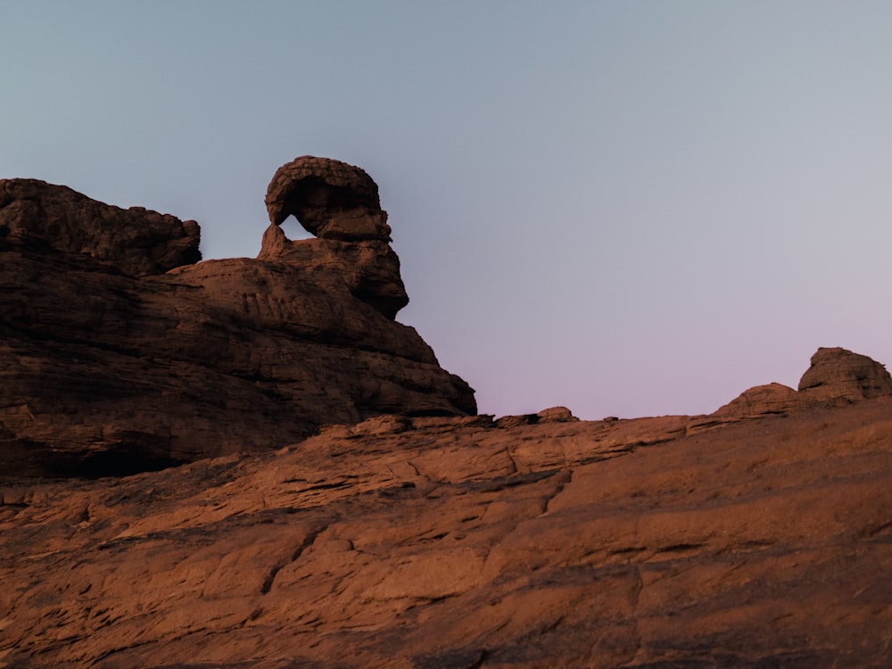 a rock formation in the middle of a desert