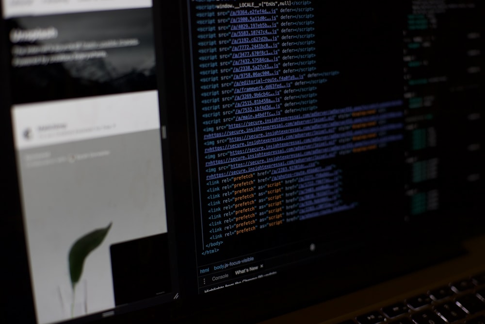 a computer monitor sitting next to a keyboard