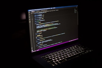 a laptop computer sitting on top of a desk