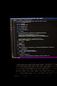 a laptop computer sitting on top of a desk