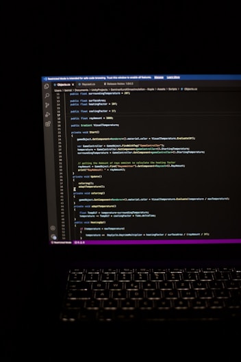 a laptop computer sitting on top of a desk