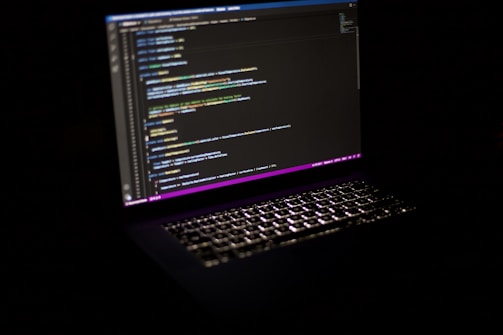 a laptop computer sitting on top of a table