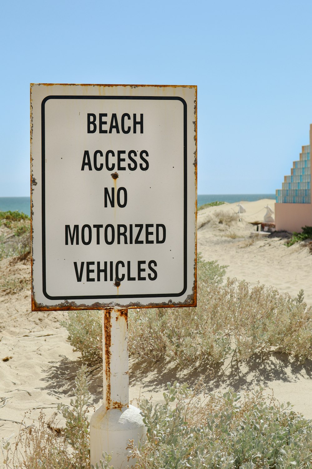 a sign that says beach access no motorized vehicles