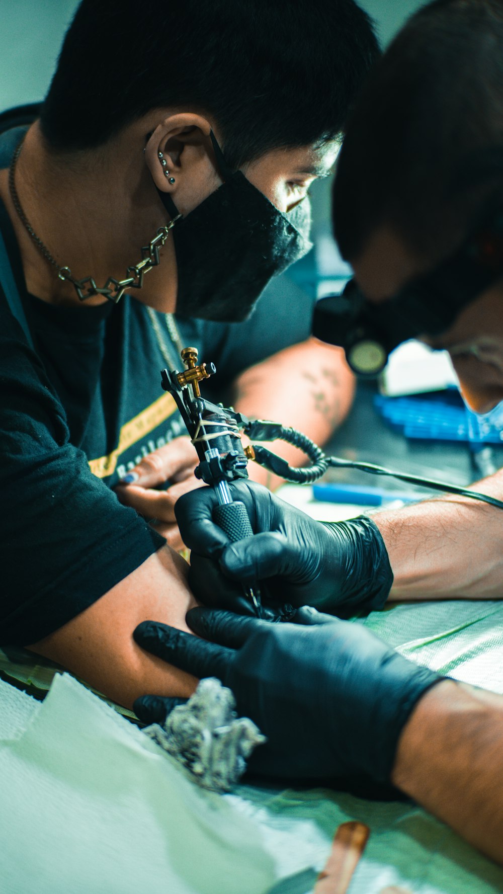 two men working on a piece of art