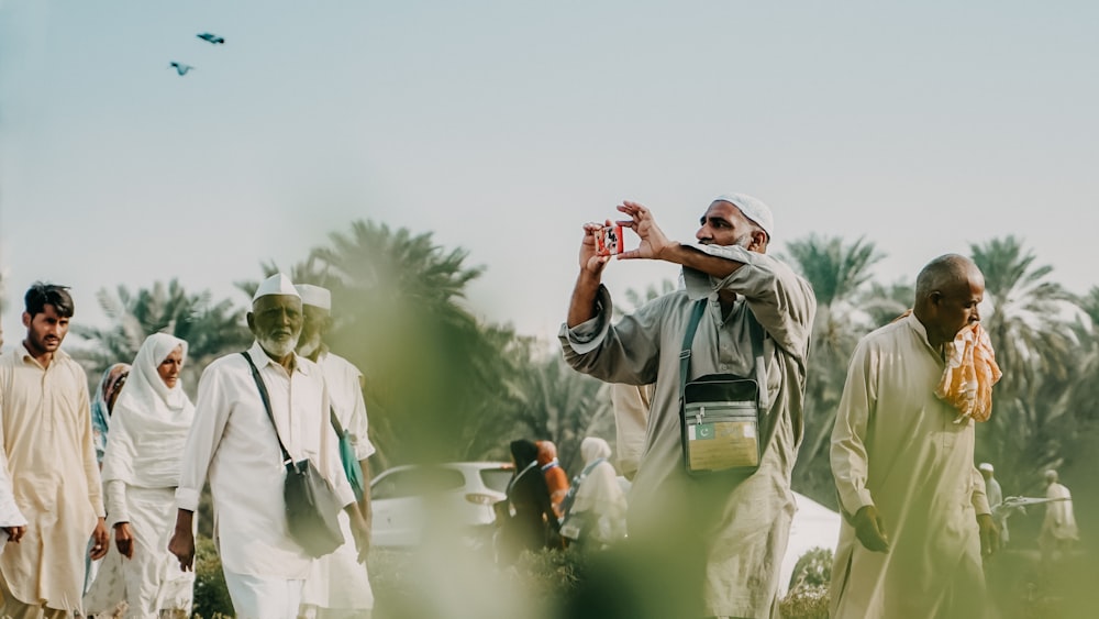 a man taking a picture of a group of people