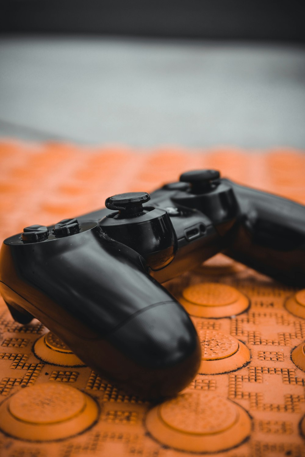 a close up of two video game controllers