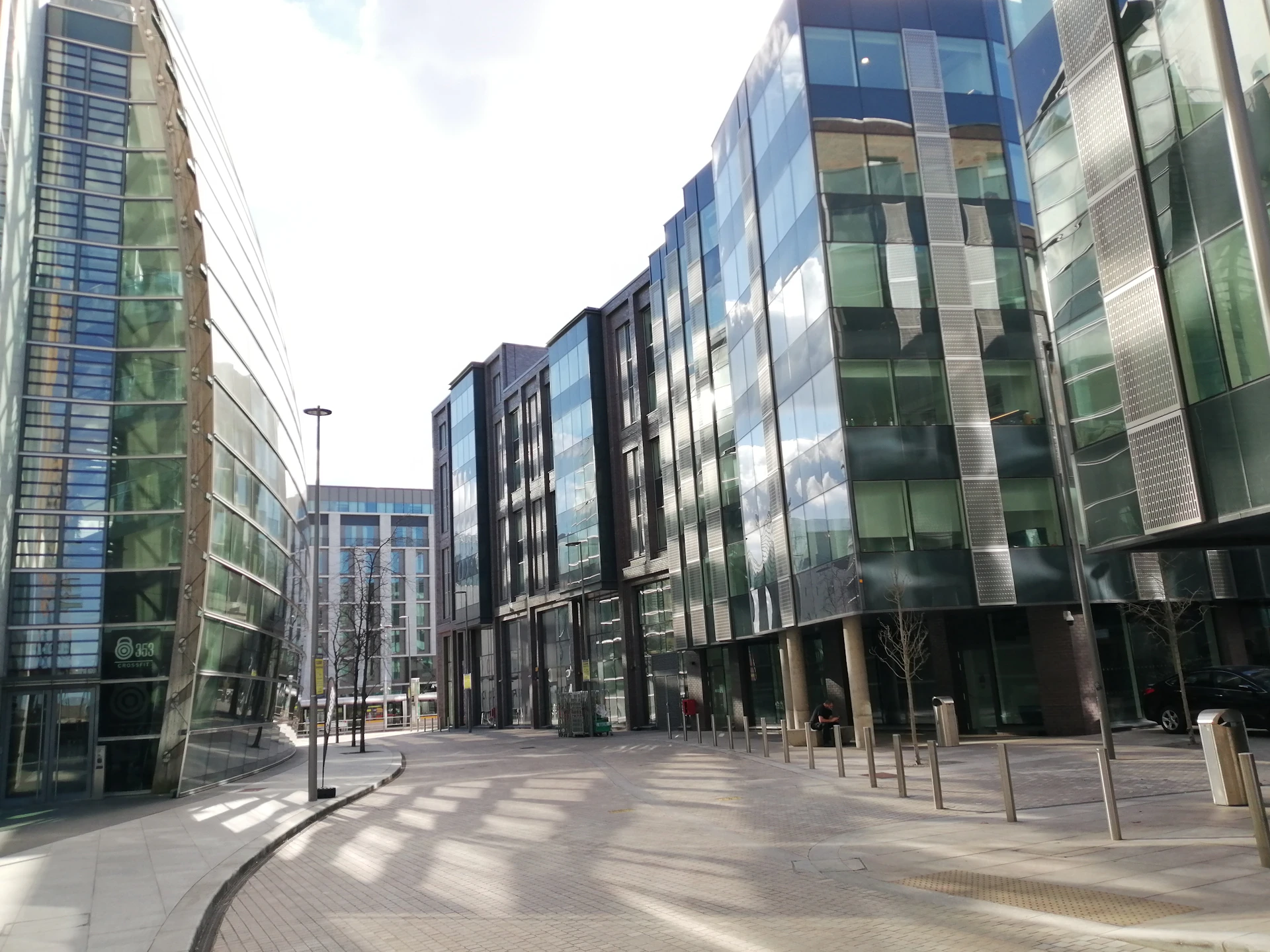 a city street lined with tall buildings next to each other