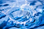 a blue water droplet with water droplets