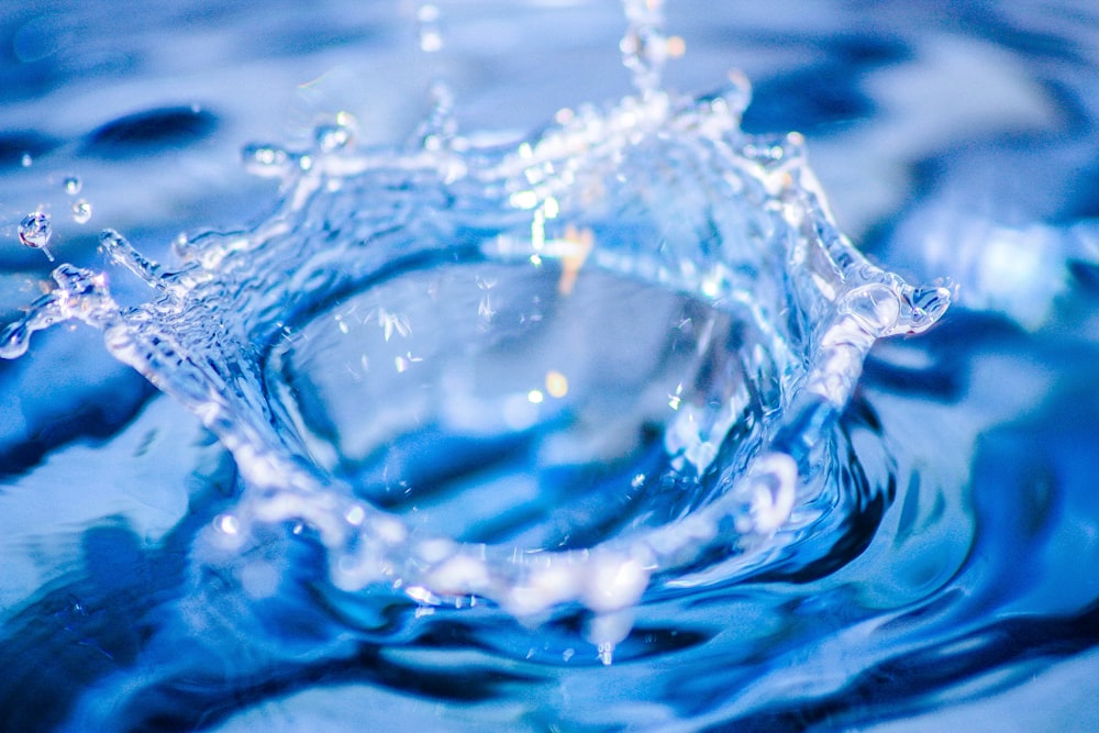 a blue water droplet with water droplets