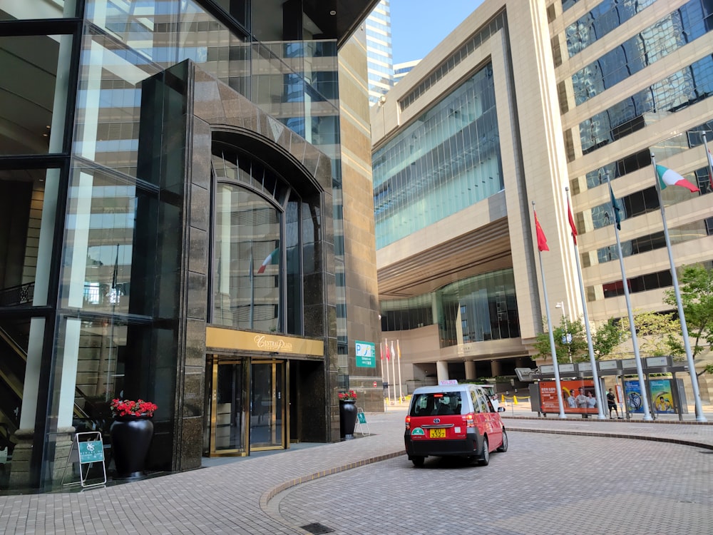 a small car is parked in front of a building