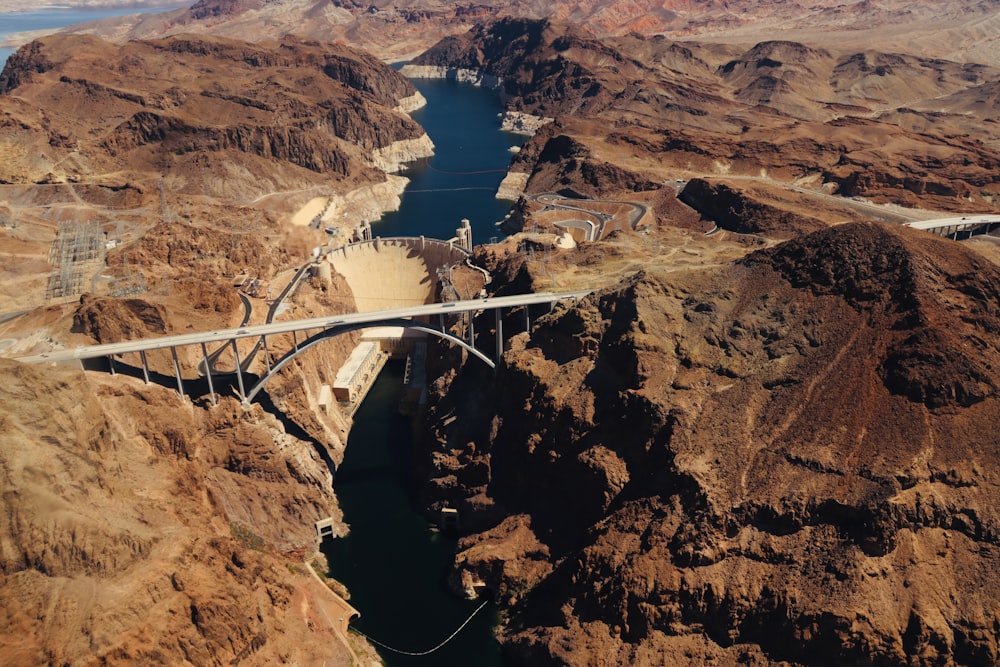 an aerial view of a bridge over a canyon