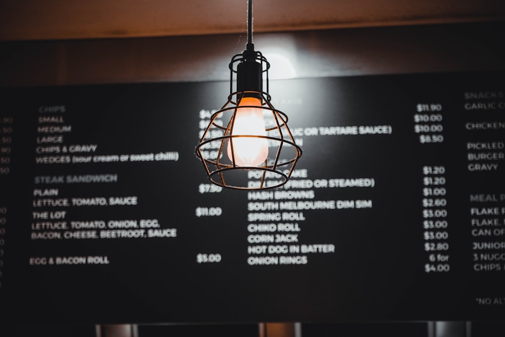 a light hanging from the ceiling of a restaurant