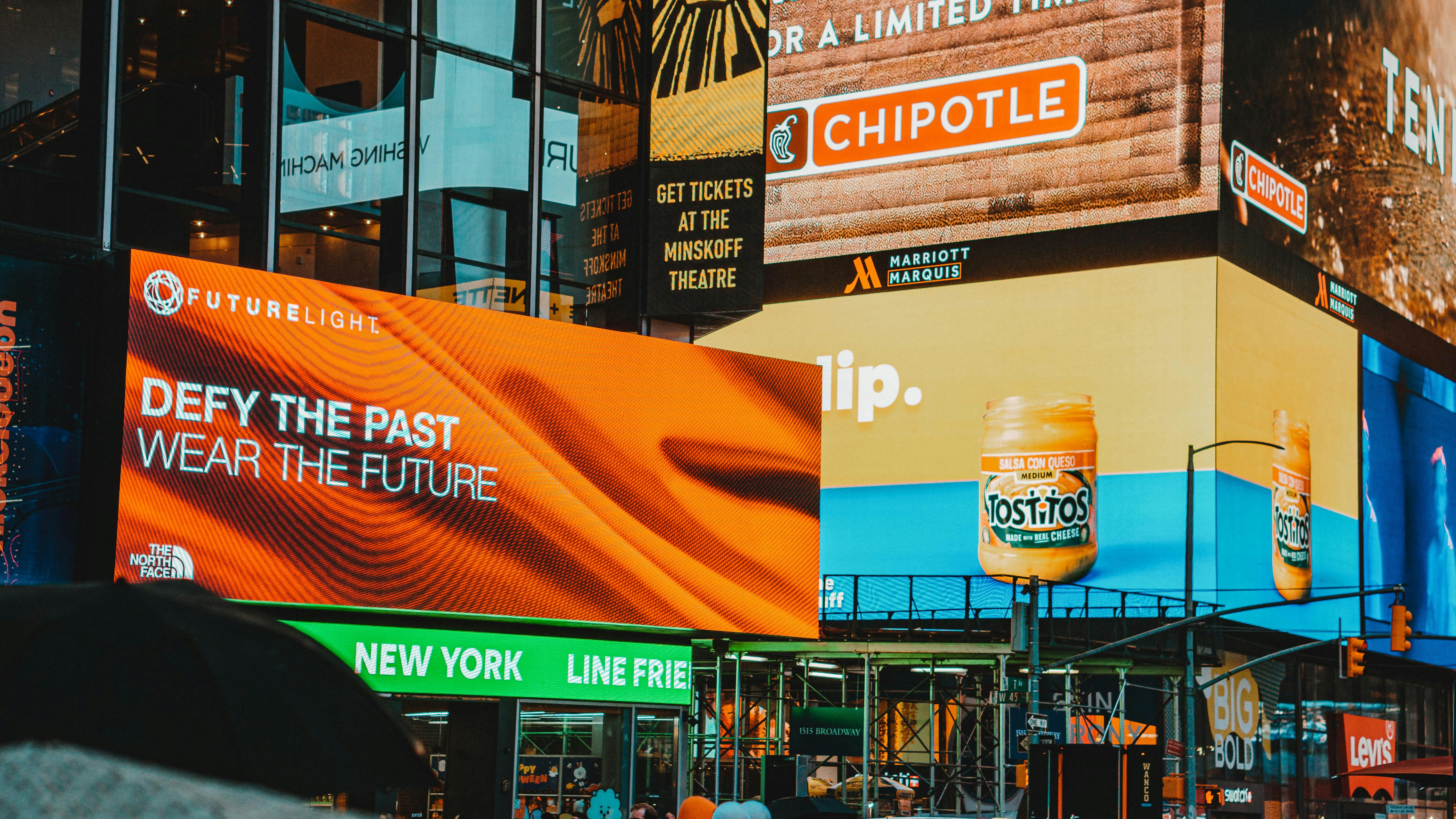 a city street filled with lots of tall buildings