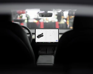 a car dashboard with a laptop on it