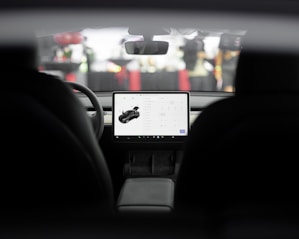 a car dashboard with a laptop on it