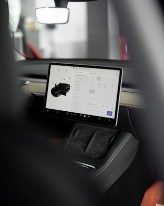a car dashboard with a tablet on it