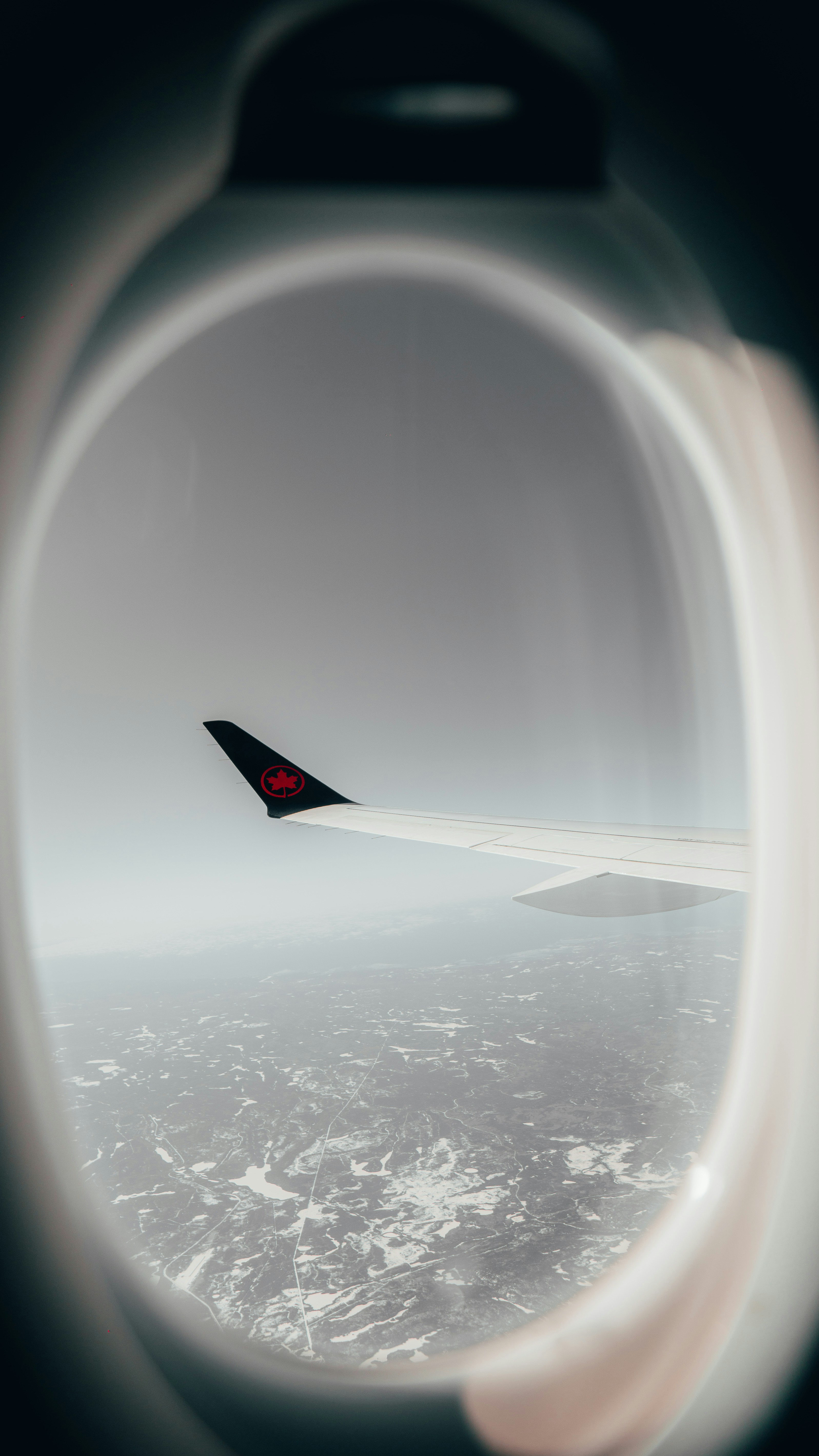 a view of the wing of an airplane in the sky