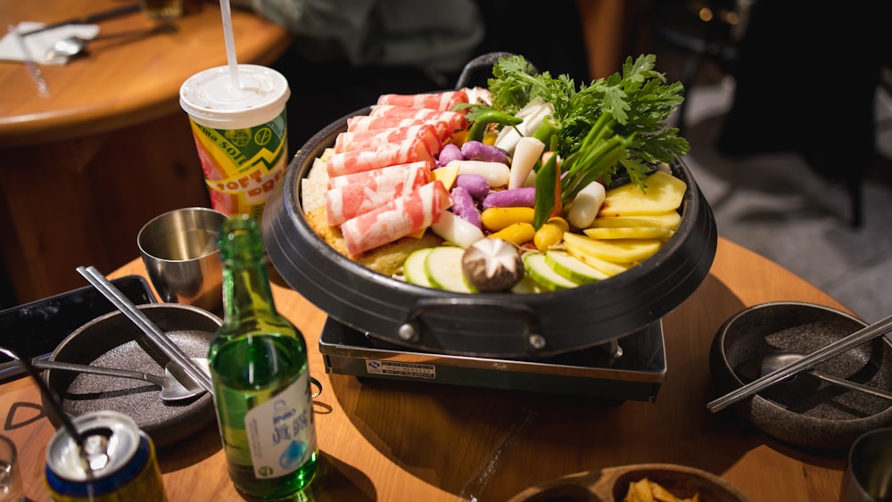 a tray of food on a table with a drink