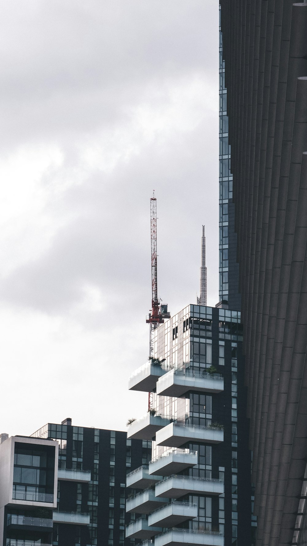 a tall building with a crane on top of it